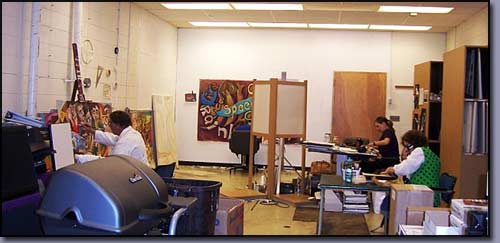 Linda Shears, Interior Designer, Author pictured in front of the Words at Play Mural painted as a volunteer with the Image and Arts Council of Troy, Michigan